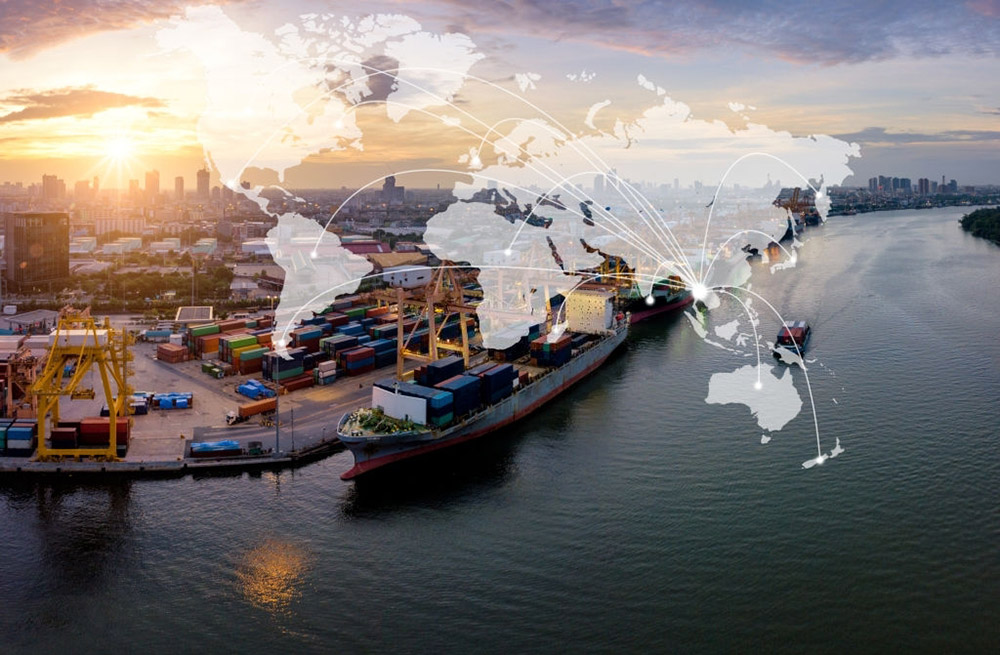 Aerial view of international port with Crane loading containers in import export business logistics with cityscape of Bangkok city Thailand at sunrise. Import and Export concept